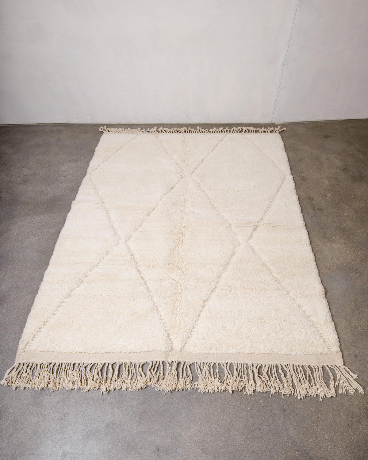 Modern, designer, handcrafted Berber rug from Morocco. Beniourain carpet with minimalist design, natural wool pile and a fluffy texture.